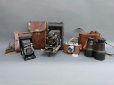 Voigtlander Bessa folding camera, cased binoculars,