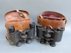 A cased pair of Dolland London x8 binoculars,