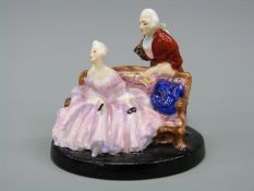 A prototype miniature Royal Doulton figure, similar to Tete a Tete (HN798) but only 7cm tall.