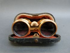 A pair of late 19thC / early 20thC ivory mounted opera glasses,