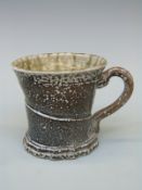 A studio pottery salt glazed stoneware mug by Walter Keeler with impressed mark, approximately 8.