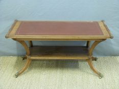 A leather inset mahogany coffee table,