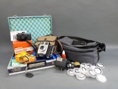 A Pentax auto 110 camera and accessories