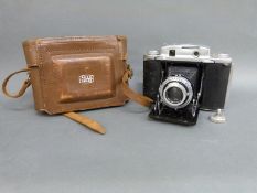 A Ross London folding camera with Wallace Heaton Ltd decal verso