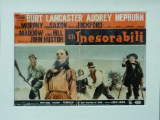 A vintage Italian film poster Gli Inesorabili starring Burt Lancaster and Audrey Hepburn,