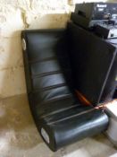 An X Rocker TM gaming chair with various audio input facility,