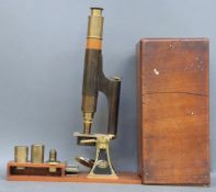 A Smith & Beck, London brass microscope in mahogany case with various lenses,