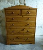 A small pine chest of two over four graduated drawers,