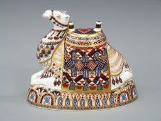 A Royal Crown Derby large paper weight in the form of a camel with gold stopper and box,