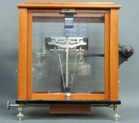 A cased set of Oertling jeweller's or laboratory scales