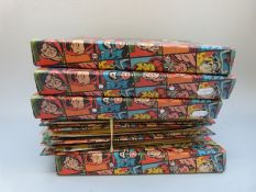 A collection of Marvel Transformers comics in plastic envelopes in ring binders,