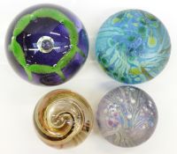 Four glass paperweights comprising Caithness Maydance in original box (74mm in diameter),