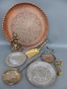 A large copper table top, brass door stop with fox design pewter plates,