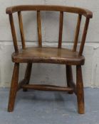 A 19thC elm seated child's stick back country style chair