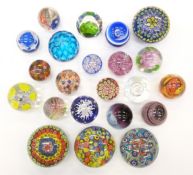 Twenty-two various decorative glass paperweights, including four large millefiori examples,