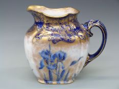 Doulton Burslem large jug with floral and scrolling gilt decoration on blue ground circa 1900,
