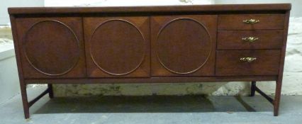 A retro sideboard with drawers and three circular panelled cupboards,