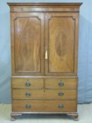 A Georgian flame mahogany linen press/housekeeper's cupboard with inlaid decoration,