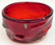 Whitefriars Knobbly ruby glass fruit bowl with original label, 22cm in diameter.