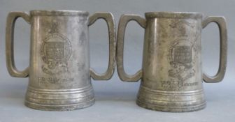 A pair of pewter loving cup trophies with Eton College coat of arms,