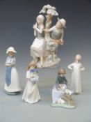 Five Nao figures including a large figure of a girl and a boy,