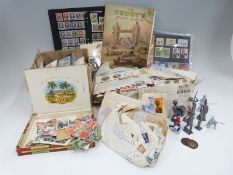 A box of loose stamps, a Trusty stamp album,