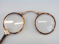 A pair of yellow metal and tortoiseshell lorgnettes in case
