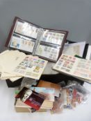 A box of GB, Commonwealth and foreign stamps, mainly on loose album pages,
