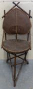 An Oriental bamboo cricket chair with Art Nouveau shaped back