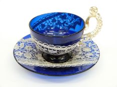 Bohemian cobalt blue glass cup and saucer with enamel lace decoration and applied aventurine