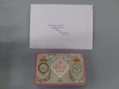 A piece of Charles & Camilla 9th April 2005 wedding cake, in tin with presentation card,
