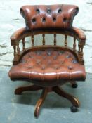 A leather Chesterfield captain's swivel chair