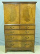 A reproduction Georgian style tallboy with cupboard above two over three graduated drawers,