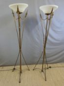 A pair of modern designer gilt metal and glass standard or uplighter lamps,