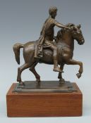A late 19thC Grand Tour bronze figure of Marcus Aurelius on horseback mounted on a wooden plinth,