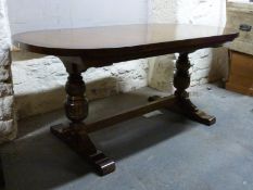 An oak oval extending refectory table and six upholstered oak chairs (2+4), H76 x W172 x D90cm,