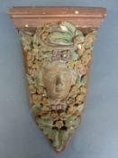 A cast plaster figural pier or wall bracket,
