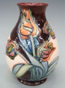 Moorcroft bulbous pedestal vase decorated with tulips,