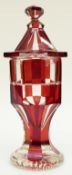 Flash overlaid cut glass lidded urn with ruby overlay over clear ground on star cut base,