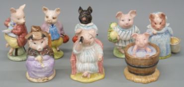 A collection of eight Beswick and Royal Albert Beatrix Potter pig figures to include Aunt Pettitoes,