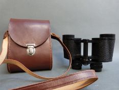 A cased pair of Carl Zeiss Jenoptem 8x30W binoculars