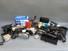 A quantity of cameras to include Minolta X-700, Olympus IS.