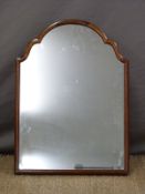 A 19thC shaped easel backed walnut mirror,