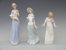 Three Nao figurines comprising a girl with bouquet of roses,