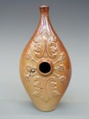 A 19thC salt glazed commemorative invalid or baby feeding flask with decoration of a young crowned