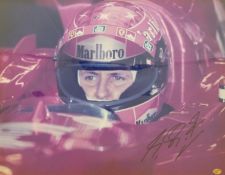 Michael Schumacher signed photograph with certificate of authenticity, framed and glazed, 38 x 50cm.