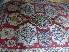 Two wool rugs with red on beige design,