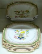A Royal Worcester dessert service of two shaped dishes and six plates decorated with enamels in the