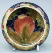 Moorcroft pedestal pin dish in the Pomegranate pattern, with W Moorcroft signature to base,
