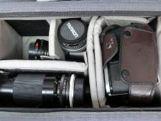 Canon AE Program1 SLR camera with four lenses (Canon 50mm 1:1.